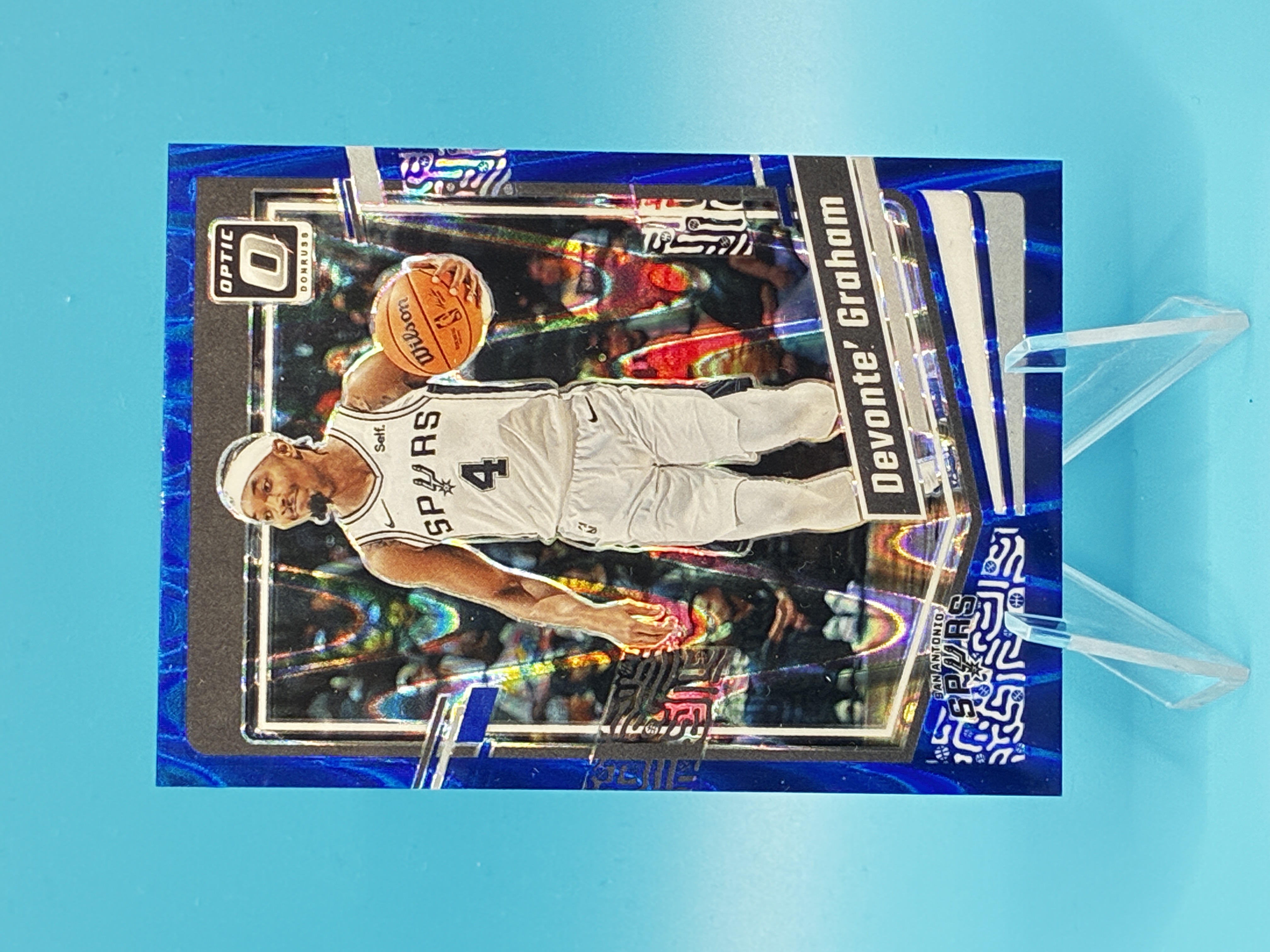 2023/2024 Panini Optic Devonte' Graham Blue Raywave 223/249 #100 San Antonio Spurs – Vorderseite