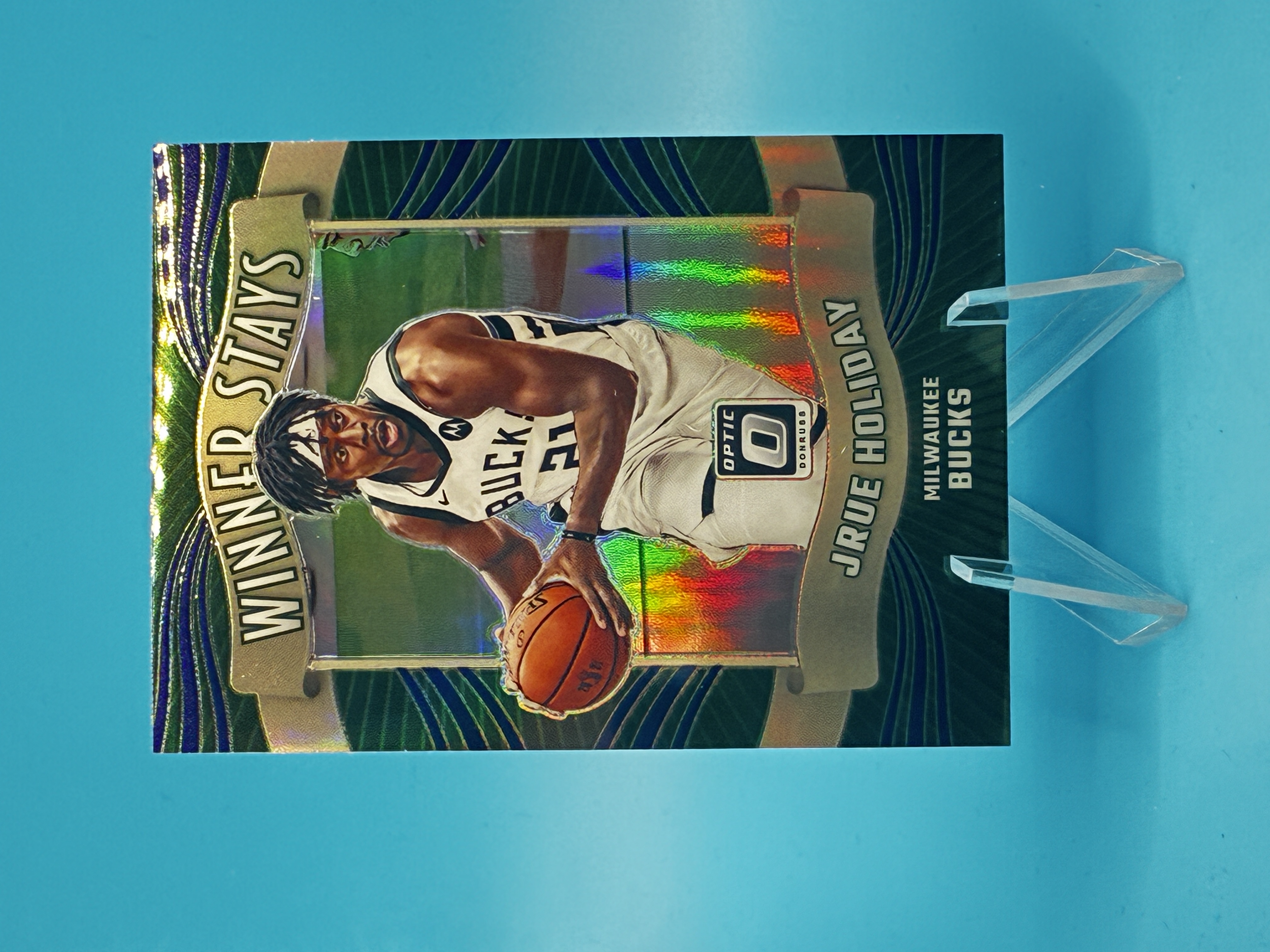 2023/2024 Panini Optic Jrue Holiday Winner Stays #9 Milwaukee Bucks – Vorderseite