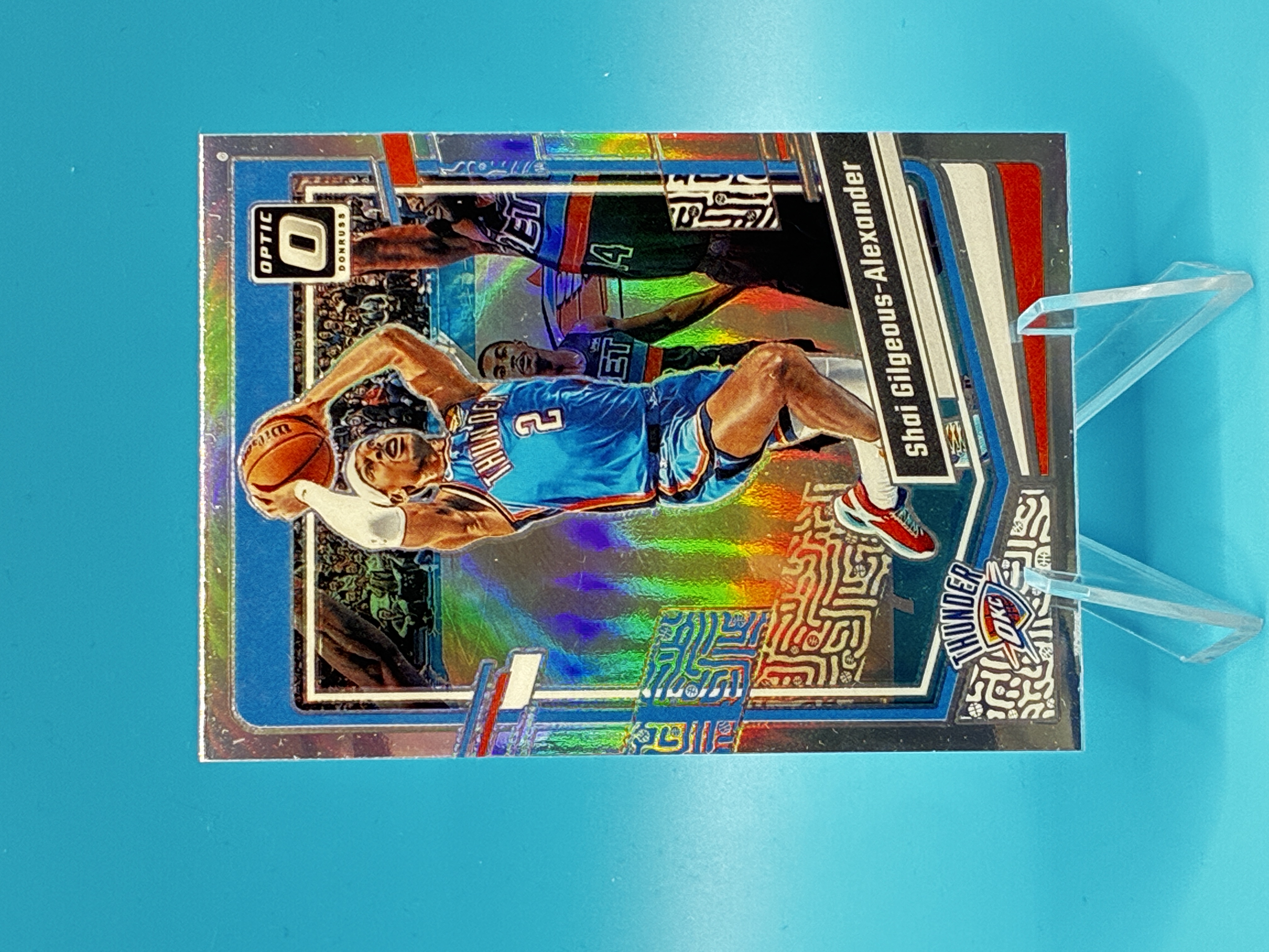 2023/2024 Panini Optic Shai Gilgeous-Alexander Holo #104 Oklahoma City Thunder – Vorderseite